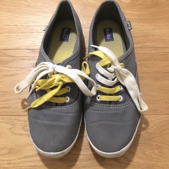 grey keds with yellow laces